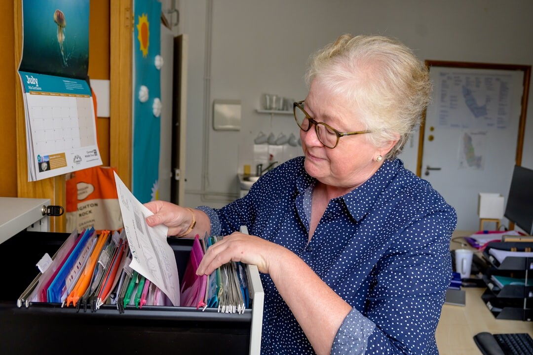 person reading dossier